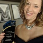 Photo of Rickie-Ann Legleitner receiveing teaching award