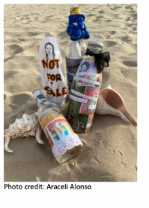 Decorated water bottles in the sand