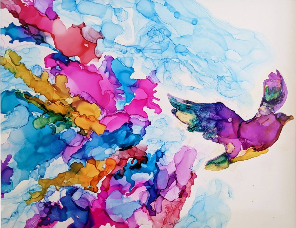 Watercolor image of bird flying away to the right. Explosion of pink, blue, orange, red colors