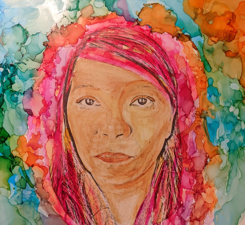 Self portrait of the artist depicting herself with colorful pink hair and background of watercolor blues and greens, staring straight ahead