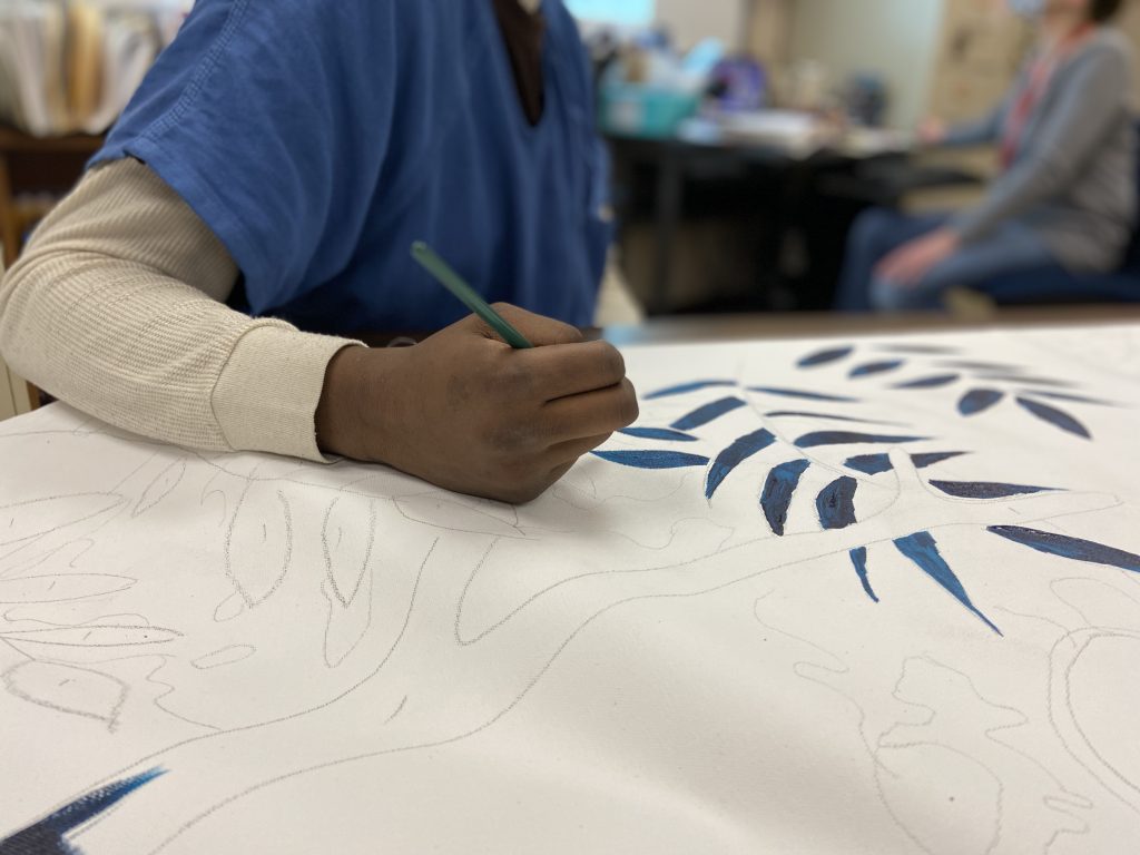 Closeup photo showing hand of teen painting