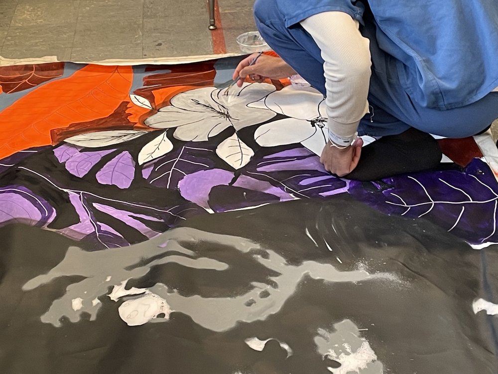 Teens working on art for mural