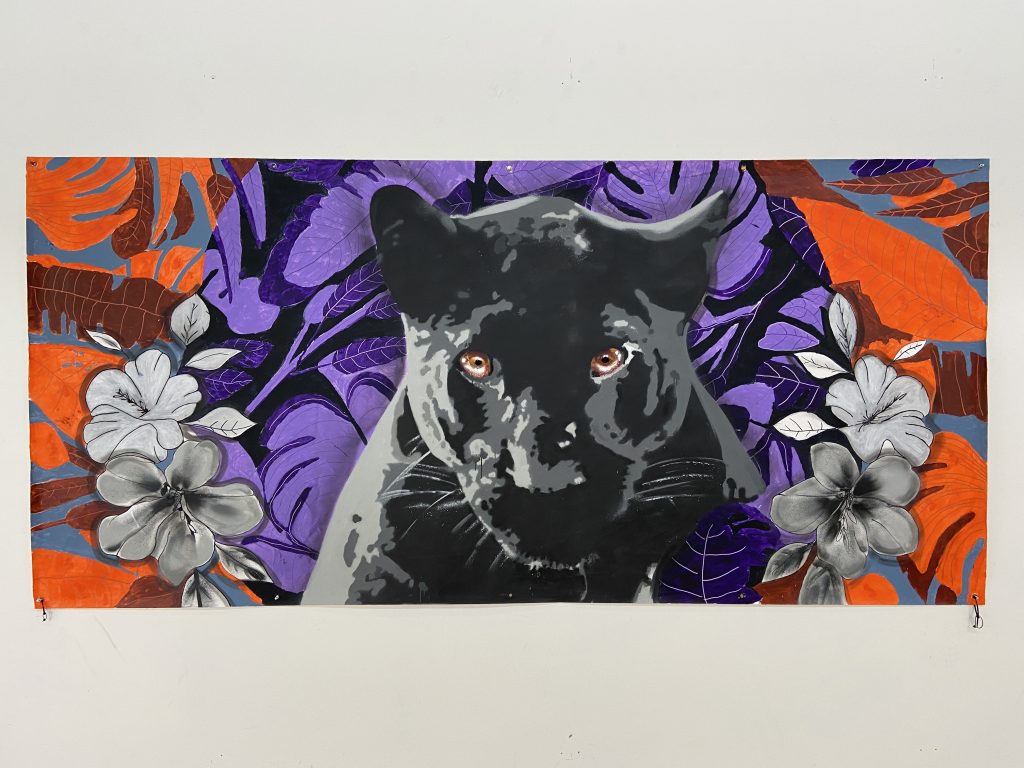 Mural showing black panther with purple plants behind it